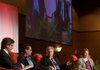 J.B. Hunt’s John Roberts III (from left), Adolfo Laurenti of Mesirow Financial, Christopher Waller of the Federal Reserve Bank of St. Louis and University of Arkansas economist Kathy Deck discuss economics Friday. 