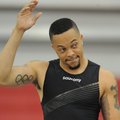 Former Arkansas sprinter Wallace Spearmon acknowledges the crowd before the start of his section of ...