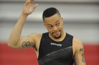 Former Arkansas sprinter Wallace Spearmon acknowledges the crowd before the start of his section of the 200 meters Saturday, Feb. 9, 2013, during the Tyson Invitational at the Randal Tyson Track Center in Fayetteville.