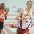 Arkansas senior Marek Niit leads South Plains sophomore Vernon Norwood going into the final lap of t...