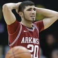 Arkansas guard Kikko Haydar walks down the court after Arkansas was called for a foul late in the se...
