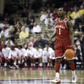 Arkansas guard Mardracus Wade brings the ball up the court in the first half of an NCAA college bask...