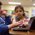 Giselle Salguero, left, and Blanca DeLeon, both fifth-graders, complete sixth gradelevel reading com...