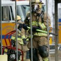 A Springdale firefighter enters the house at 2717 S. Old Missouri Road on Friday morning. The Spring...