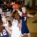 Jamayne Potts of Bentonville puts up a shot Friday as Rogers Heritage’s Ellen Lundy goes for the blo...