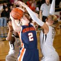 Bentonville senior Julia Garrad (right) defends a shot by Rogers Heritage senior Ashley Ward during ...