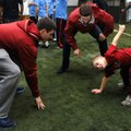 Noah Kittelson, center, counts down as Kevin Lazas, left, and Andy Turnbow, 9, a Special Olympics at...