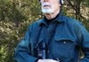 Rick Farrar of Franklin wears a SongFinder amplifier clipped to his belt. He likes it that the band that secures its two earpieces fits across the back of his head rather than over the top. 