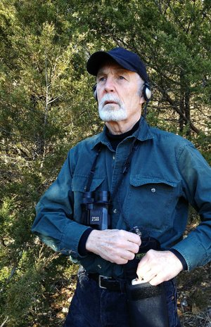 Rick Farrar of Franklin wears a SongFinder amplifier clipped to his belt. He likes it that the band that secures its two earpieces fits across the back of his head rather than over the top. 