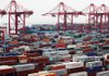 Shipping containers are stacked at the Yangshan Deep Water Port in Shanghai, China, on Jan. 31. Last month, China’s trade expanded with exports rising 25 percent from a year earlier and imports increasing 28.8 percent, according to government data released Friday. 