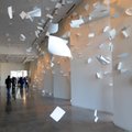 Attendees of the 21c Museum Hotel opening walk past the site-specific instillation A Sudden Gust of ...