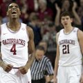 Arkansas' Coty Clarke (4) celebrates during the second half of the Razorbacks' 80-69 win over Florid...