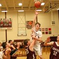 Lincoln junior Dylan McConnell shoots over the heads of Gentry defenders Blake Boyd (25) and Robbie ...