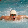Fayetteville’s Ben Heil competes in the 100 butterfly on Jan. 31 during the Bentonville High School ...