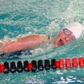 Rogers’ Lisa Lauschke swims in the 200 freestyle on Jan. 31 during the Bentonville Invitational Meet...