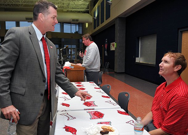 sean-rochelle-left-pictured-in-this-2009-file-photo-with-former-arkansas-basketball-coach-john-pelphrey-has-worked-with-the-razorback-foundation-since-2008