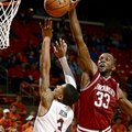 Arkansas' Marshawn Powell blocks a shot by Auburn's Chris Denson during the second half of their NCA...