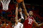 Arkansas' Marshawn Powell blocks a shot by Auburn's Chris Denson during the second half of their NCAA college basketball game, Wednesday, Feb. 13, 2013, in Auburn, Ala. Arkansas won 83-75. (AP Photo/Todd J. Van Emst)