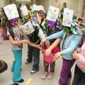 Kindergartners from Maranda Wilson’s class at Monitor Elementary School in Springdale hand out candy...