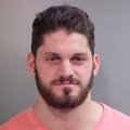 Austin Flynn, a defensive end for the Razorbacks' football team, was arrested Wednesday. 