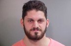 Austin Flynn, a defensive end for the Razorbacks' football team, was arrested Wednesday. 