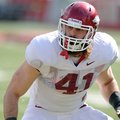 Arkansas defender Austin Flynn runs drills during a 2012 practice at Donald W. Reynolds Razorback St...