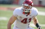 Arkansas defender Austin Flynn runs drills during a 2012 practice at Donald W. Reynolds Razorback Stadium in Fayetteville.