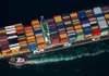 A tugboat helps guide a Mediterranean Shipping Co. (MSC) ship loaded with freight containers in this aerial photograph approaching the Port of Long Beach in Long Beach, California, U.S., on Friday, Feb. 1, 2013. The U.S. Census Bureau is scheduled to release trade balance figures on Feb. 8. Photographer: Tim Rue/Bloomberg