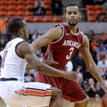 Auburn's Josh Wallace (11) defends Arkansas' Rickey Scott (3) during an NCAA college basketball game...