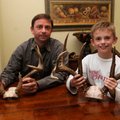 Eight-year-old Davis Stephens of Fayetteville, right, scored a Triple Trophy Award this deer season ...