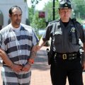 John Proffitt Jr., left, of Rogers, is escorted June 6 by Sheriff’s Office deputy Ted Arhangelsky fo...