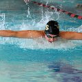 John Hedgecock of Bentonville swims the fly in the 200-yard medley relay Wednesday during the NWA Co...