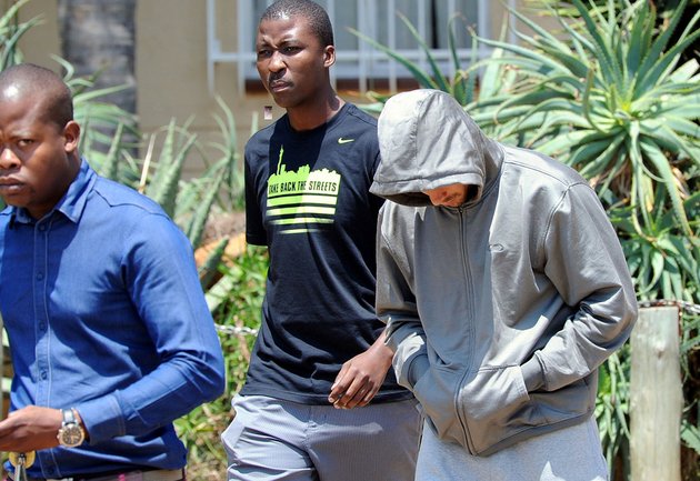 olympic-athlete-oscar-pistorius-leaves-the-boschkop-police-station-east-of-pretoria-south-africa-on-thursday-feb-14-2013-en-route-to-appear-in-court-charged-with-murder