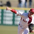 Arkansas pitcher Ryne Stanek fires a pitch in the first inning of Friday afternoon's season opener a...