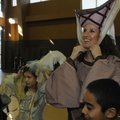 Student Katherine Wood, left, and Ashley Shaver Noland, parent, adjust their costumes Thursday durin...