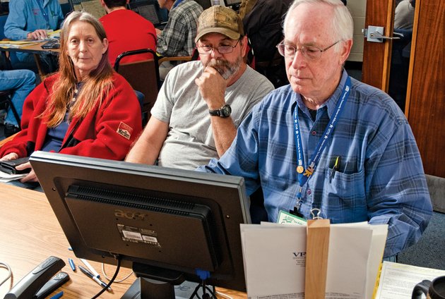 barbara-and-russell-easter-left-look-on-as-gene-alden-does-their-taxes-during-a-free-tax-prearation-event-held-by-the-aarp-at-the-hughes-center-in-russellville