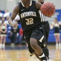Jamayne Potts of Bentonville brings the ball up the court during Tuesday’s game against Rogers at Ro...