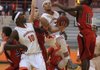 Little Rock Hall’s Gregg Easter (middle) drives to the basket between Russellville defenders Jalen Curtis (11) and Dakota Young during the Warriors’ 82-44 victory over the Cyclones on Friday at Cirks Arena in Little Rock. 
