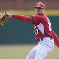 Arkansas pitcher Barrett Astin delivers a pitch Saturday, Feb. 16, 2013, during the second inning of...