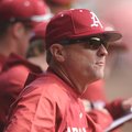 Arkansas coach Dave Van Horn directs his players Saturday, Feb. 16, 2013, during the third inning of...