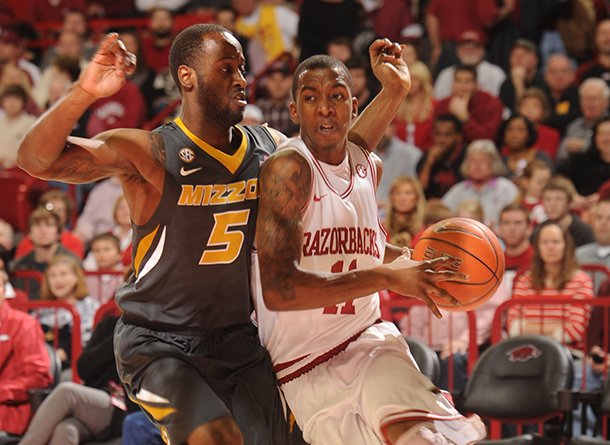 arkansas-sophomore-guard-bj-young-right-drives-along-the-baseline-as-missouri-senior-keion-bell-defends-saturday-in-bud-walton-arena-in-fayetteville-young-scored-18-points-including-seven-points-in-the-final-29-seconds-as-the-razorbacks-beat-missouri-73-71