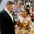 Savannah Byford, 17, a Bentonville senior, smiles Friday at her father, Steve Byford, as she is anno...