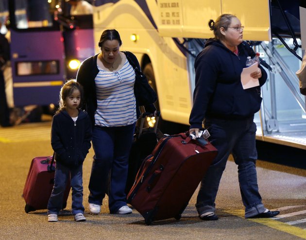 passengers-from-the-disabled-carnival-triumph-cruise-ship-arrive-by-bus-at-the-hilton-riverside-hotel-in-new-orleans-friday-feb-15-2013-the-ship-had-been-idled-for-nearly-a-week-in-the-gulf-of-mexico-following-an-engine-room-fire