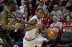 Arkansas guard BJ Young (11) drives to the basket against Missouri's Keion Bell (5) during the Razorbacks' 73-71 win over Missouri. Young scored 18 points, including seven in the final 29 seconds. (AP Photo/Gareth Patterson)