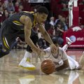 Missouri's Phil Pressey (1) loses the ball as he is guarded by Arkansas captain Kikko Haydar, right,...