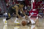 Missouri's Phil Pressey (1) loses the ball as he is guarded by Arkansas captain Kikko Haydar, right, during the second half an NCAA college basketball game in Fayetteville, Ark., Saturday, Feb. 16, 2013. Arkansas defeated Missouri 73-71. (AP Photo/Gareth Patterson)