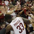 Arkansas forward Marshawn Powell celebrates with the student section following Arkansas' 73-71 win o...