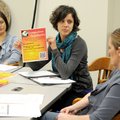 Margot Jackson, center, talks to other members of the Fayetteville Forward Economic Accountability C...