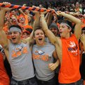 Brandon Gates, 17, (above) from left, Brandon White, 17, and Josh Qualls, 18, raise the spirit stick...
