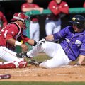 Arkansas catcher Jean Ramirez tries to tag out Western Illinois base runner Erik Maki during the fou...